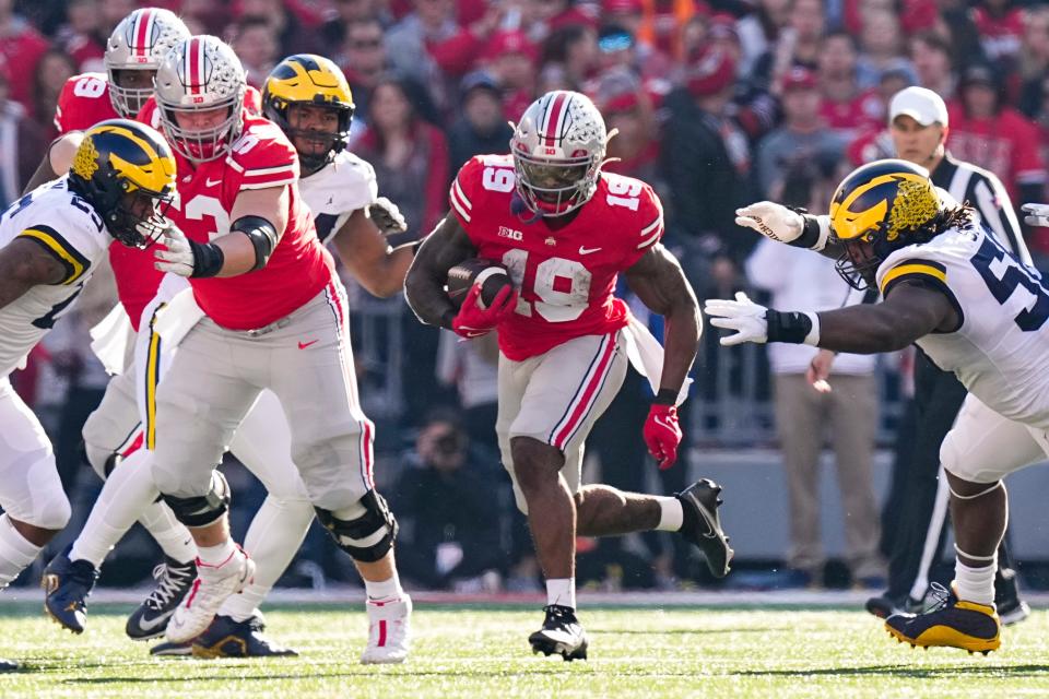 Nov 26, 2022; Columbus, Ohio, USA;  Ohio State Buckeyes running back Chip Trayanum (19) runs during the first half of the NCAA football game against the Michigan Wolverines at Ohio Stadium. Mandatory Credit: Adam Cairns-The Columbus Dispatch