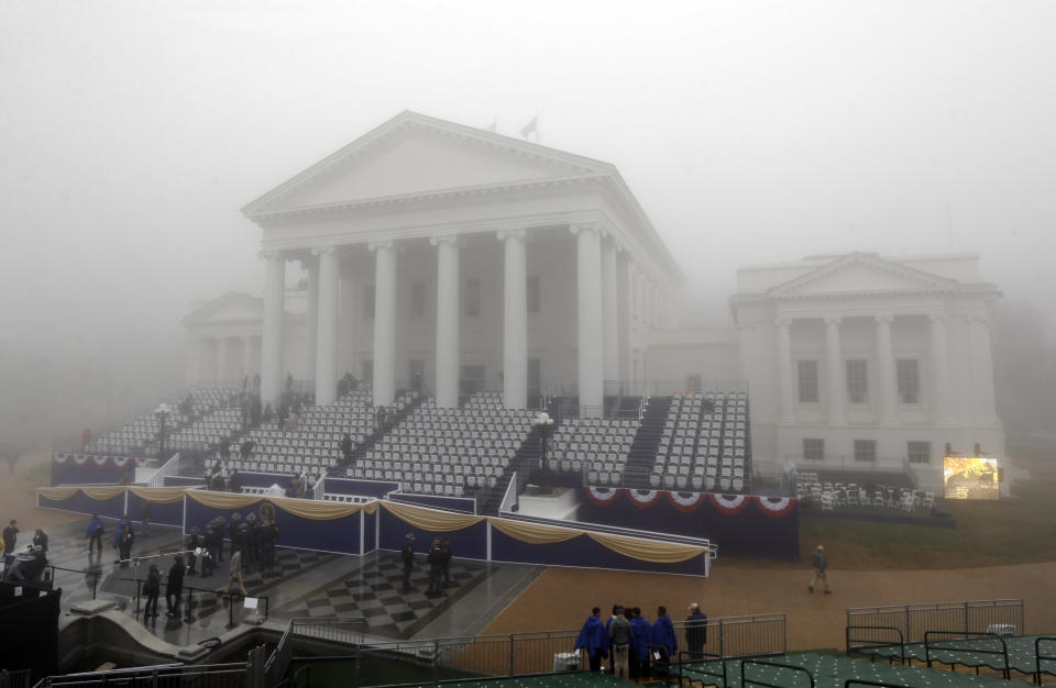 Fog envelopes the Virginia State Capitol as preparations take place for inaugural ceremonies for Governor-elect Terry McAuliffe in Richmond, Va., Saturday, Jan. 11, 2014. The former Democratic National Committee chairman and fundraiser for Bill and Hillary Clinton will be inaugurated at about noon Saturday at the state Capitol designed by Virginia's second governor, Thomas Jefferson. (AP Photo/Patrick Semansky)