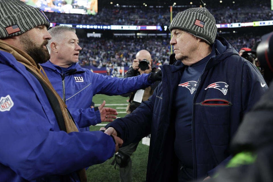New York Giants head coach Brian Daboll, left, meets with New England Patriots head coach Bill Belichick on the field after an NFL football game, Sunday, Nov. 26, 2023, in East Rutherford, N.J. (AP Photo/Adam Hunger)