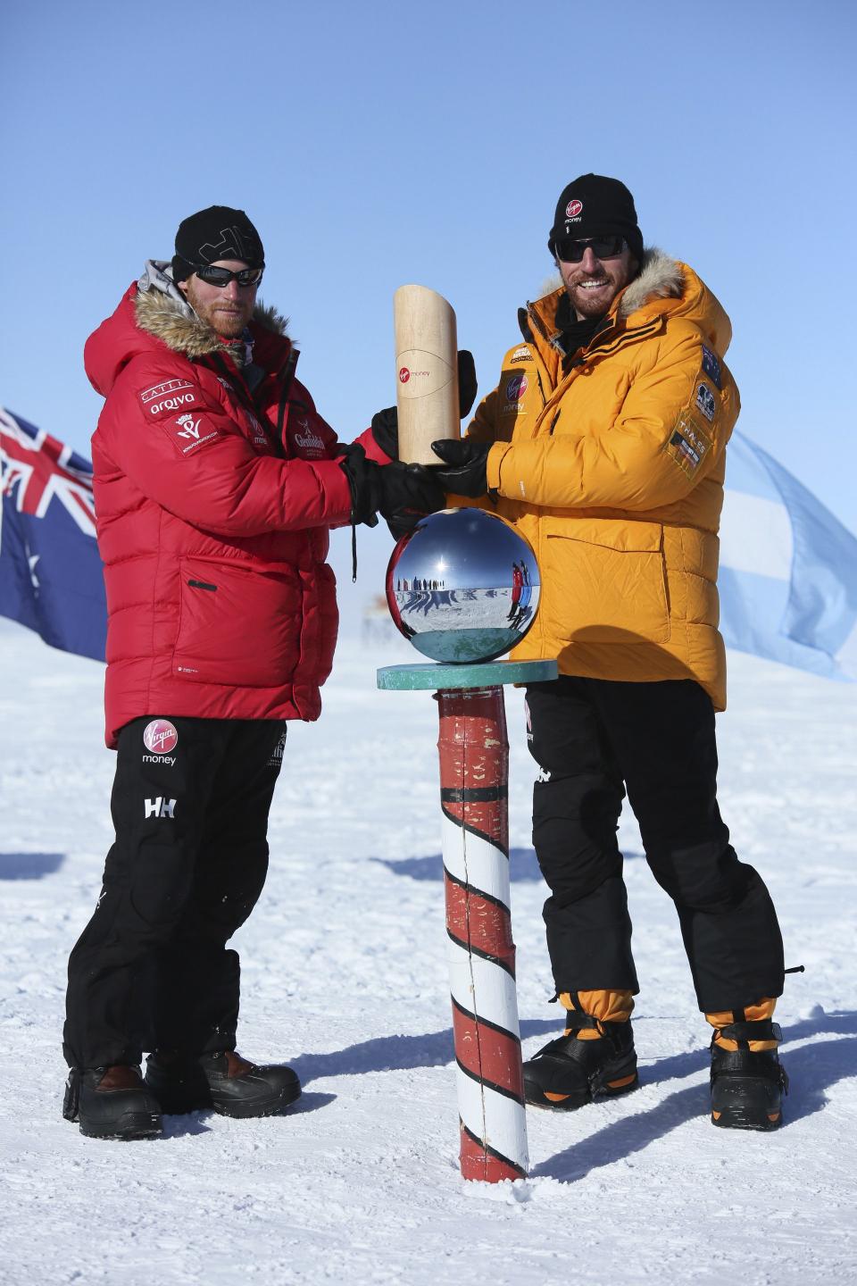 Prince Harry poses for a photographs with Heath Jamieson of Team Commonwealth at the South Pole