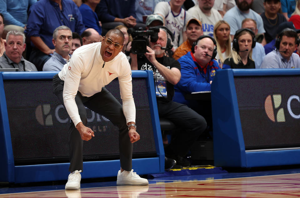 LAWRENCE, KANSAS - FEBRUARY 24:  Head coach Rodney Terry of the Texas Longhorns reacts on the bench during the 1st half of the game against the Kansas Jayhawks at Allen Fieldhouse on February 24, 2024 in Lawrence, Kansas. (Photo by Jamie Squire/Getty Images)