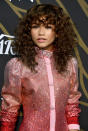<p>When your curls are healthy and flourishing like Zendaya’s, why not embrace them? The young star’s layers also enhance her amazing caramel hair color. (Photo: Frazer Harrison/Getty Images) </p>