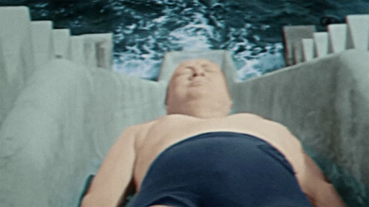 A video truly does show Winston Churchill losing his swimsuit after going backwards down a water slide. 