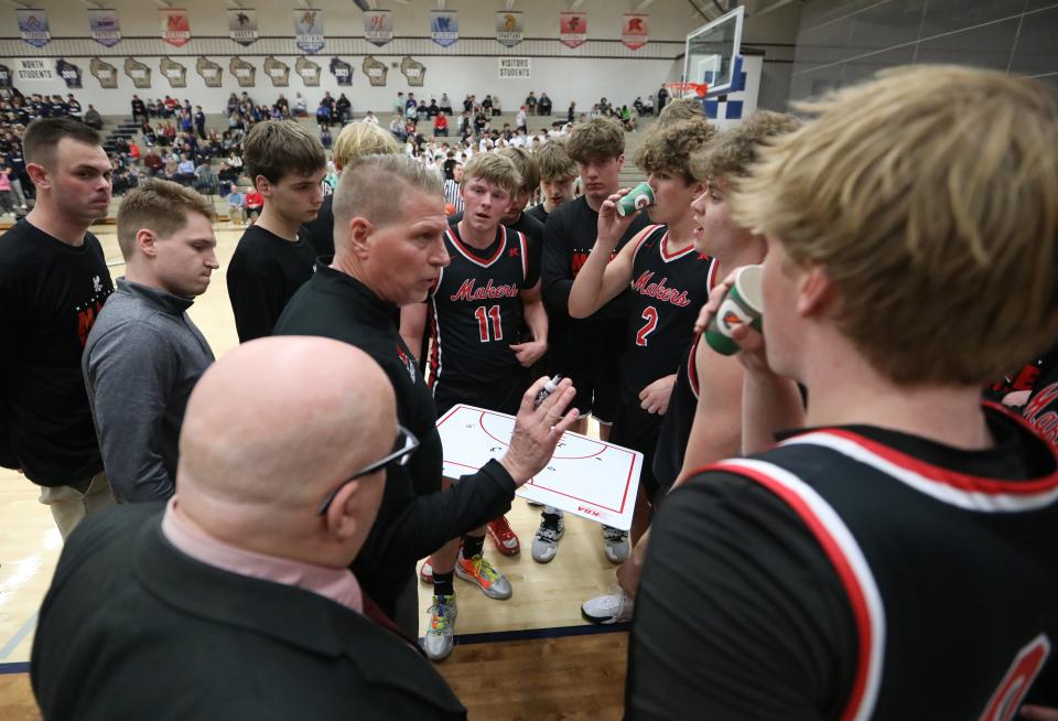 Jon Murphy, center, who coached Kimberly for the past three seasons after 33 years at Seymour, announced Friday he is retiring.