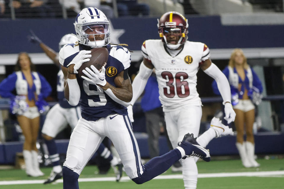 Dallas Cowboys wide receiver KaVontae Turpin (9) catches a touchdown pass in front of Washington Commanders cornerback Danny Johnson (36) during the second half of an NFL football game Thursday, Nov. 23, 2023, in Arlington, Texas. (AP Photo/Michael Ainsworth)