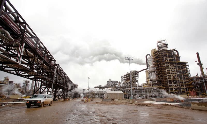 FILE PHOTO: A truck drives down a street at Syncrude's oil sands operation near Alberta