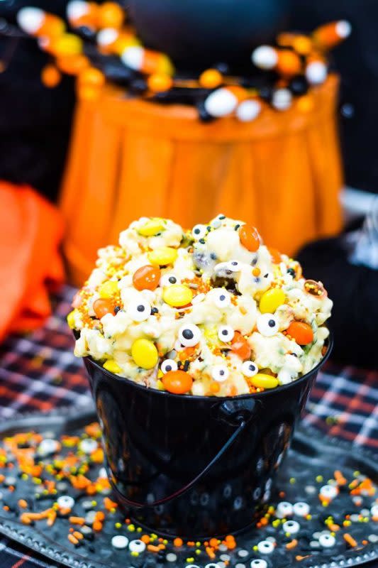 <p>Soulfully Made</p><p>Your little monsters won't be able to stop digging their hands in this snack mix. </p><p><strong>Get the recipe: <a href="https://www.soulfullymade.com/monster-munch-halloween-popcorn/" rel="nofollow noopener" target="_blank" data-ylk="slk:Monster Munch Halloween Popcorn;elm:context_link;itc:0;sec:content-canvas" class="link ">Monster Munch Halloween Popcorn</a></strong></p>