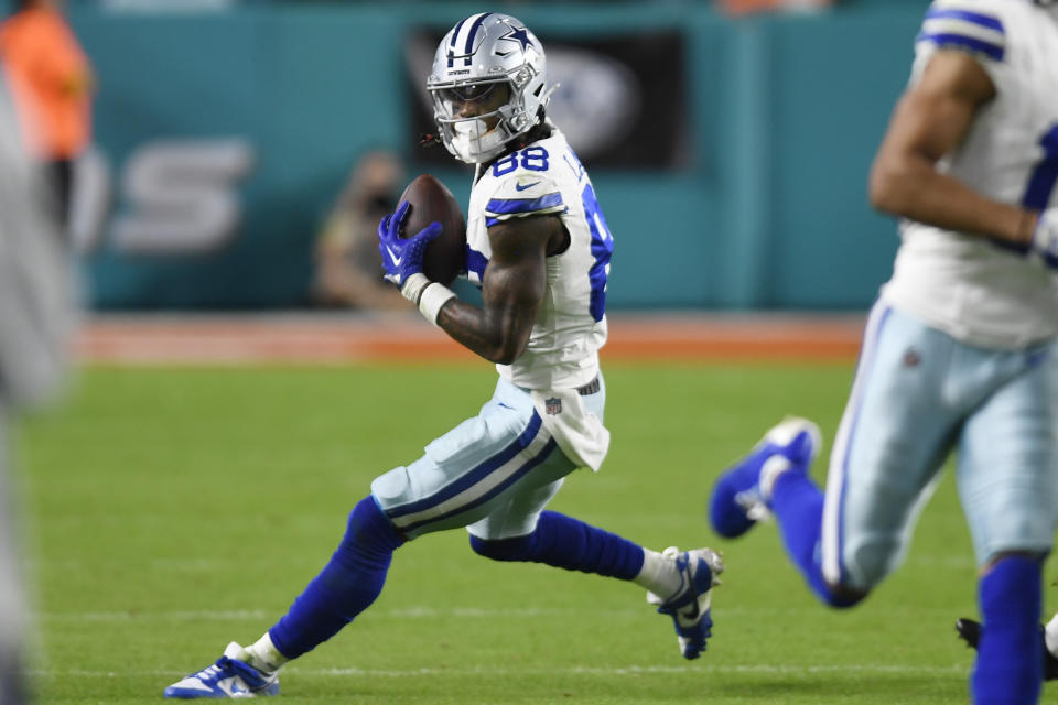 Dallas Cowboys wide receiver CeeDee Lamb (88) runs with the football during the second half of an NFL football game against the Miami Dolphins, Sunday, Dec. 24, 2023, in Miami Gardens, Fla. (AP Photo/Michael Laughlin)