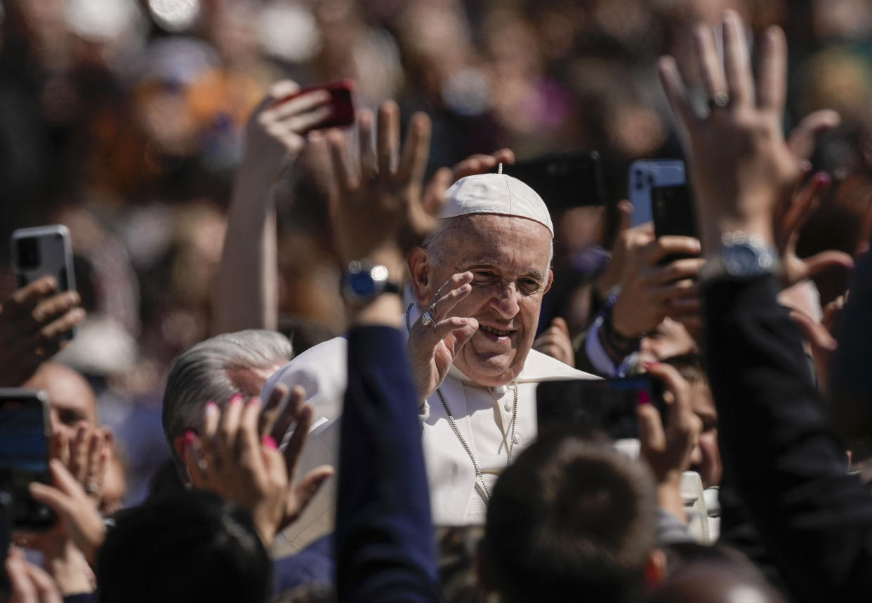 Pope Francis blesses the faithful from his popemobile in St. Peter's Square at The Vatican at the end of the Easter Sunday mass, Sunday, April 9, 2023. (AP Photo/Alessandra Tarantino)