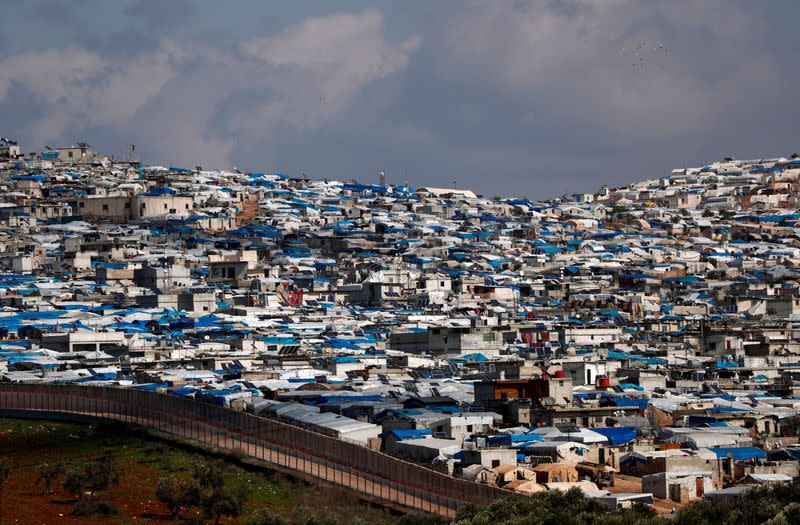 FILE PHOTO: The Atma IDP camp, located in Idlib Governorate of Syria and housing internally displaced Syrians, is pictured from a Turkish border village in Hatay province