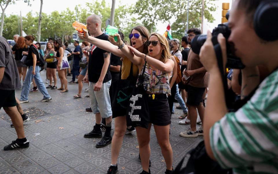 Protestors shot tourists with water guns during a protest against mass tourism in Barcelona