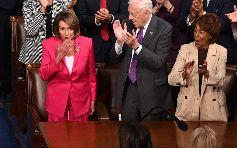 Nancy Pelosi (L) blows a kiss as US President Joe Biden acknowledges her - JIM WATSON/AFP