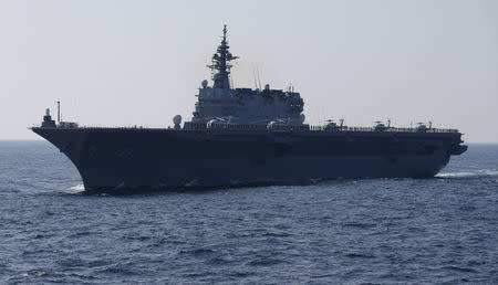 FILE PHOTO : The Izumo military helicopter carrier of the Japan Maritime Self-Defense Force (JMSDF) sails during its fleet review at Sagami Bay, off Yokosuka, south of Tokyo October 18, 2015. REUTERS/Toru Hanai/File Photo