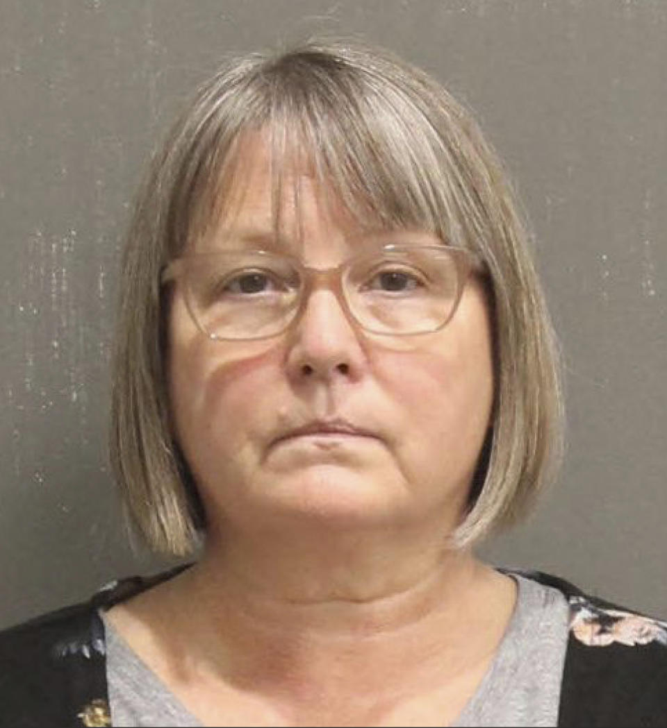 This booking photo released by the Metro Nashville, Tenn., Police Department, shows Lisa Marie Eisenhart. A Washington, D.C., judge on Wednesday, Feb. 17, 2021, ordered that a Georgia woman and her Tennessee son remain jailed pending trial on charges for their involvement in the Jan. 6 riot at the U.S. Capitol. Lisa Eisenhart is accused of breaking into the Capitol with her son, Eric Munchel, who was photographed carrying flexible plastic handcuffs in the Senate chamber. (Metro Nashville Police Department via AP)