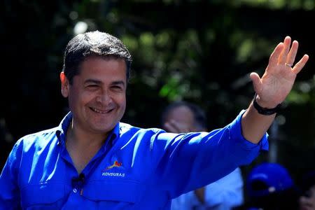 Honduras President and National Party candidate Juan Orlando Hernandez gestures during his closing campaign rally ahead of the upcoming presidential election, in Tegucigalpa, Honduras November 19, 2017. REUTERS/Jorge Cabrera/Files