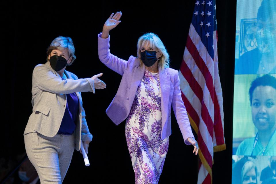 First lady Jill Biden walks on stage with the president of the American Federation of Teachers, Randi Weingarten, during the group's convention,  July 15, 2022, in Boston.