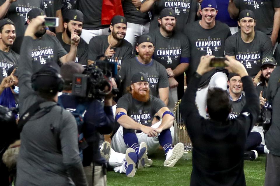 ARLINGTON, TEXAS - OCTOBER 27:  Justin Turner #10 and the Los Angeles Dodgers pose for a photo after defeating the Tampa Bay Rays 3-1 in Game Six to win the 2020 MLB World Series at Globe Life Field on October 27, 2020 in Arlington, Texas. (Photo by Ronald Martinez/Getty Images)