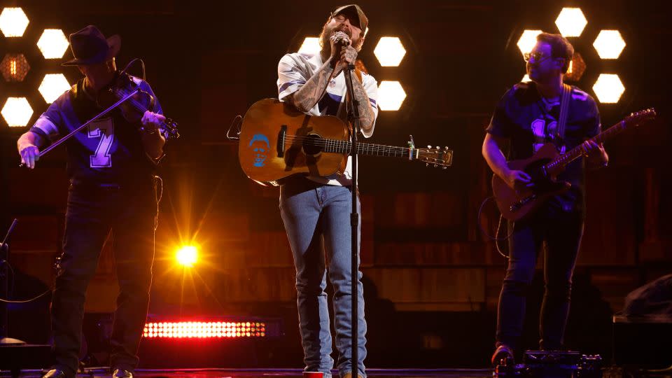 Post Malone performing at the 2024 ACM Awards in Texas on Thursday. - Jason Kempin/Getty Images