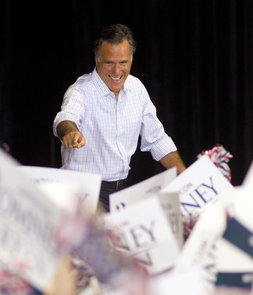 Republican presidential candidate and former Massachusetts Gov. Mitt Romney waves to supporters before he makes a speech in Miami, Wednesday, Sept. 19, 2012. (AP Photo/J Pat Carter)