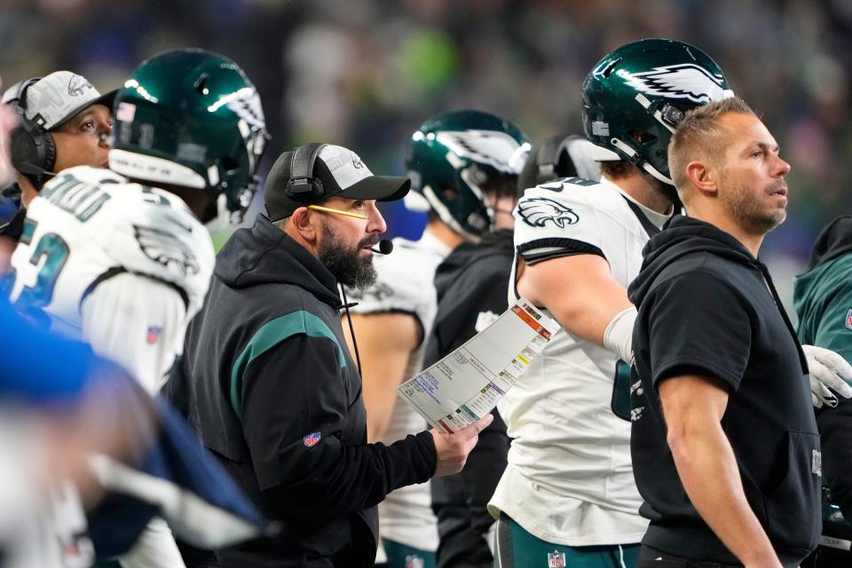 Philadelphia Eagles senior defensive assistant Matt Patricia, center, looks on from the sideline during an NFL football game against the Seattle Seahawks, Monday, Dec. 18, 2023, in Seattle. The Seahawks won 20-17.