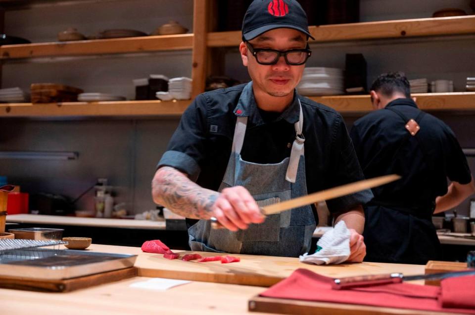 Kru Contemporary Japanese Cuisine chef and co-owner Billy Ngo prepares sushi Friday, Jan. 26, 2024, at the East Sacramento restaurant. Lezlie Sterling/lsterling@sacbee.com