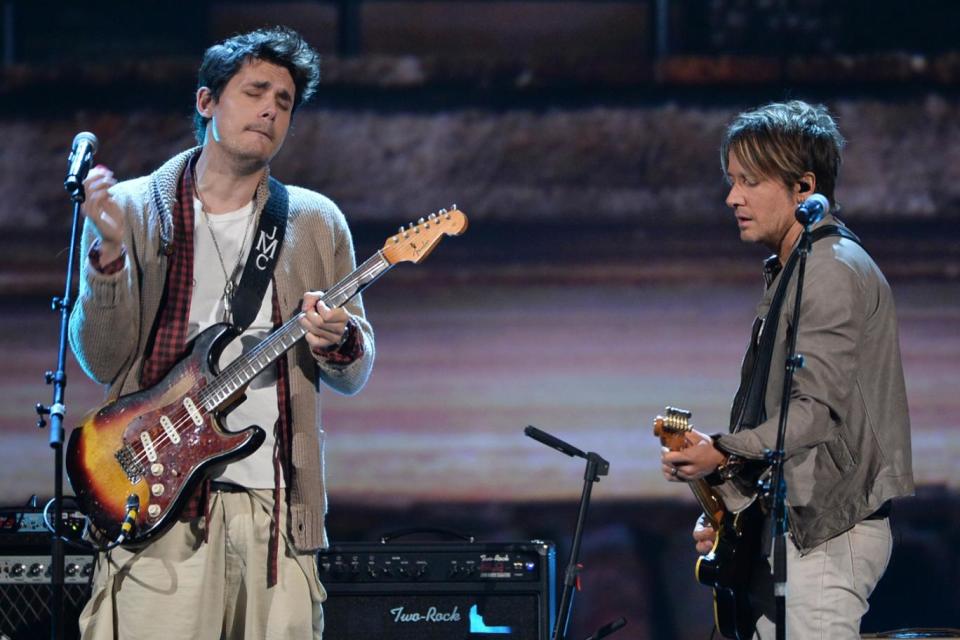 Guitar Hero: The musician pictured performing alongside Keith Urban in 2014 (Photo by Kevin Winter/Getty Images)