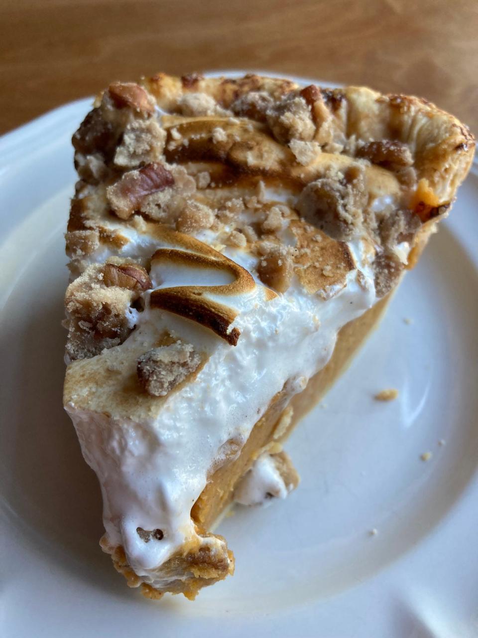 A slice of sweet potato pie with toasted meringue from Pots and Pans Co.