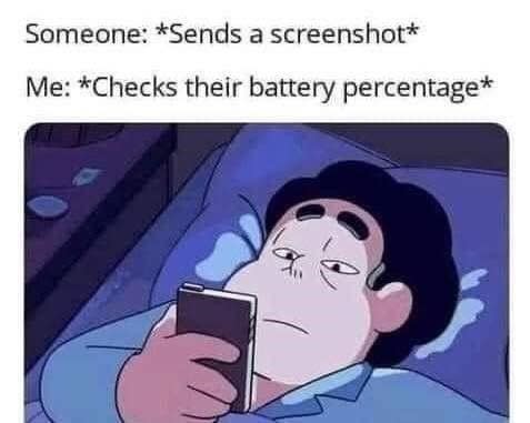 A meme shows a cartoon character lying in bed, looking at their phone. The text reads: "Someone: *Sends a screenshot* Me: *Checks their battery percentage*"