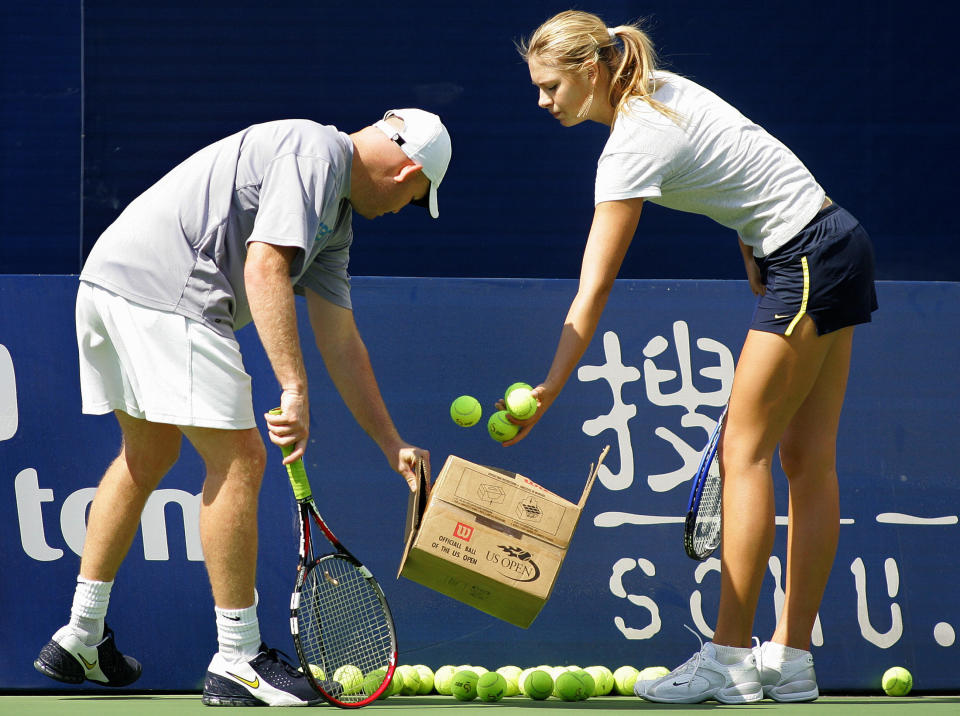 Pictured left, former coach Michael Joyce and Maria Sharapova collect tennis balls.