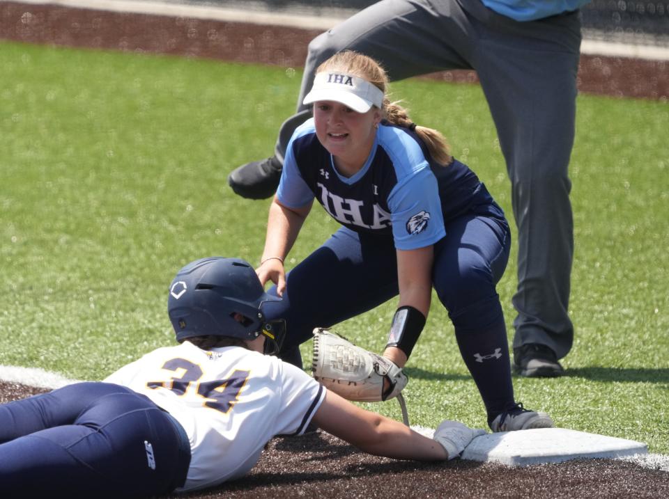 Wood-Ridge, NJ May 27, 2023 --  Taylor Menzel of Ramsey is picked off and tagged by Chelsea Lapp of IHA as Immaculate Heart Academy edged Ramsey 1-0 to win the Bergen County Softball Tournament.