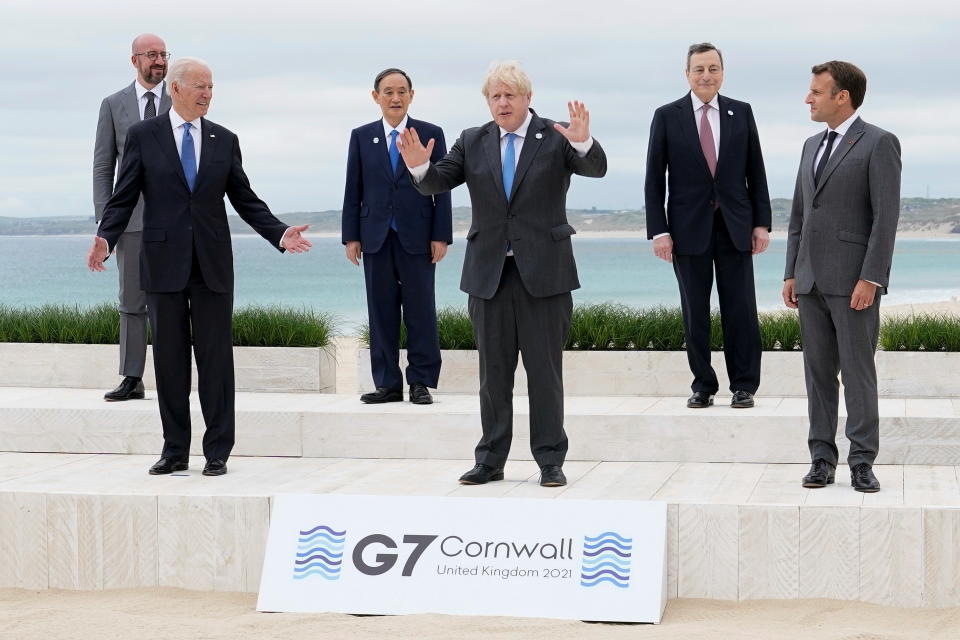 U.S. President Joe Biden and British Prime Minister Boris Johnson gesture as they pose for a family photo with G-7 leaders; European Council President Charles Michel, Japan's Prime Minister Yoshihide Suga, Italy's Prime Minister Mario Draghi and French President Emmanuel Macron at the G-7 summit, in Carbis Bay, Cornwall, Britain June 11, 2021. Patrick Semansky/Pool via REUTERS     TPX IMAGES OF THE DAY