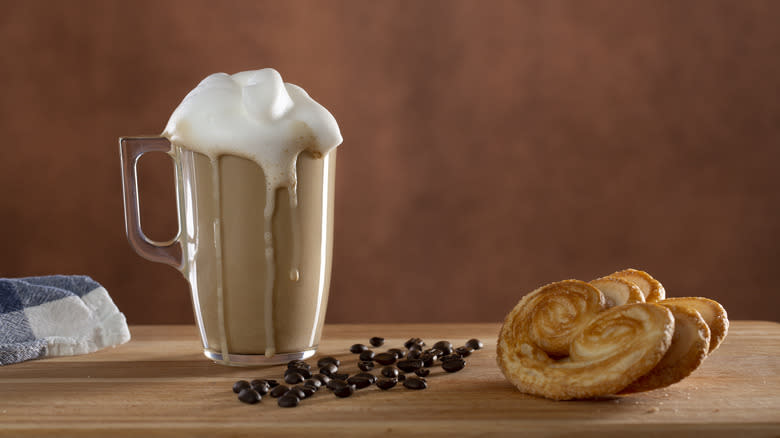 Cold frothy coffee with pastries