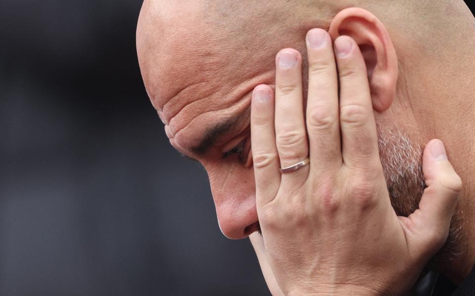 Pep Guardiola looks pensive - ACTION IMAGES