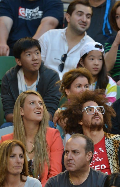 Women's Singles Champion Belarus's Victoria Azarenka watches Serbia's Novak Djokovic in Melbourne on January 27, 2013. The world number one's tennis-playing stock has never been higher, but further repairs to her image may be appropriate