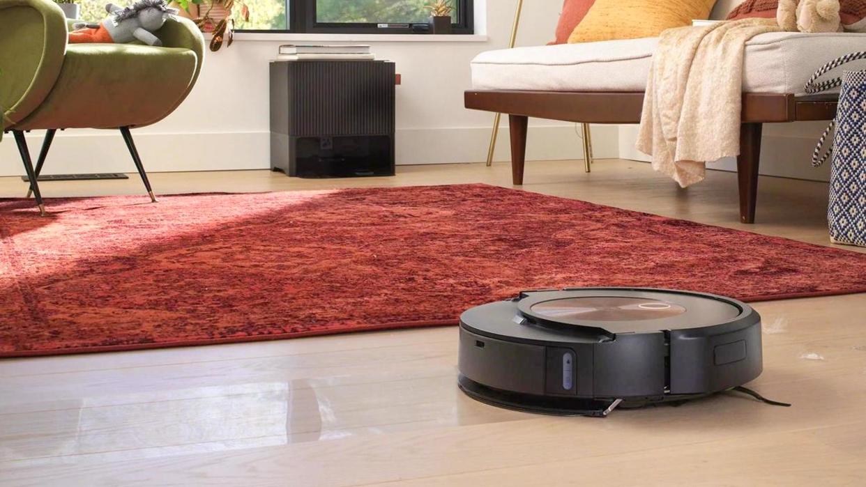  Roomba J9+ Combo robot vacuum and mop shown on floor. 