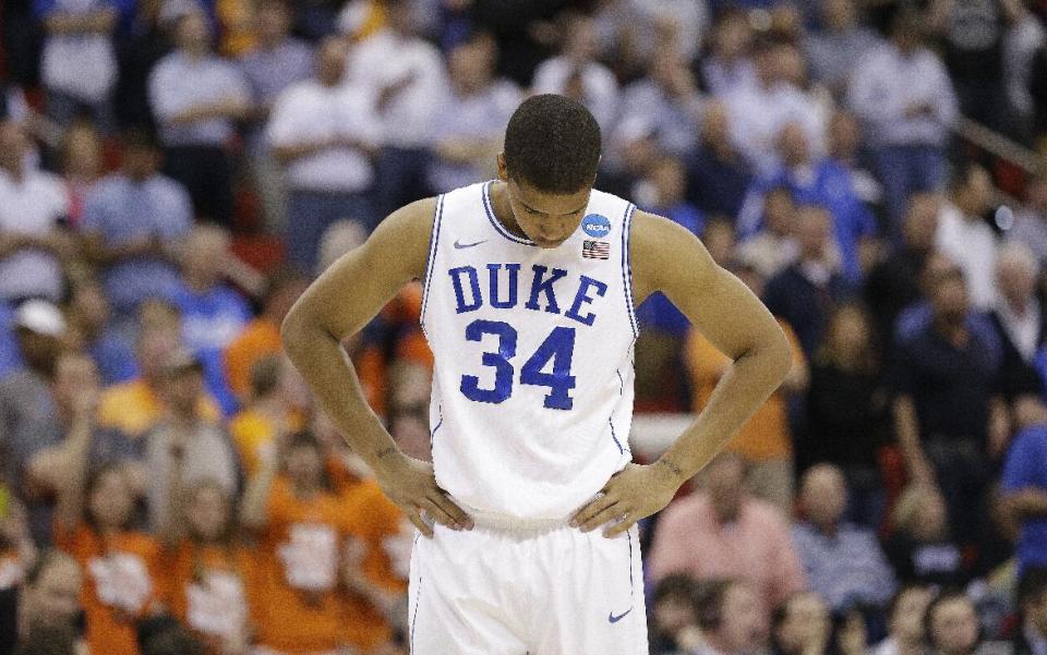 Duke guard Andre Dawkins (34) walks off the court after the second half of an NCAA college basketball second-round game against Mercer, Friday, March 21, 2014, in Raleigh, N.C. Mercer won 78-71. (AP Photo/Gerry Broome)