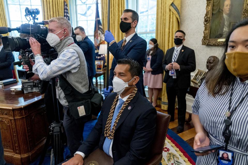 Rep. Kaiali'i Kahele, D-Hawaii, attends a meeting with President Joe Biden and other members of the Congressional Asian Pacific American Caucus Executive Committee in the Oval Office at the White House in Washington, Thursday, April 15, 2021. (AP Photo/Andrew Harnik)