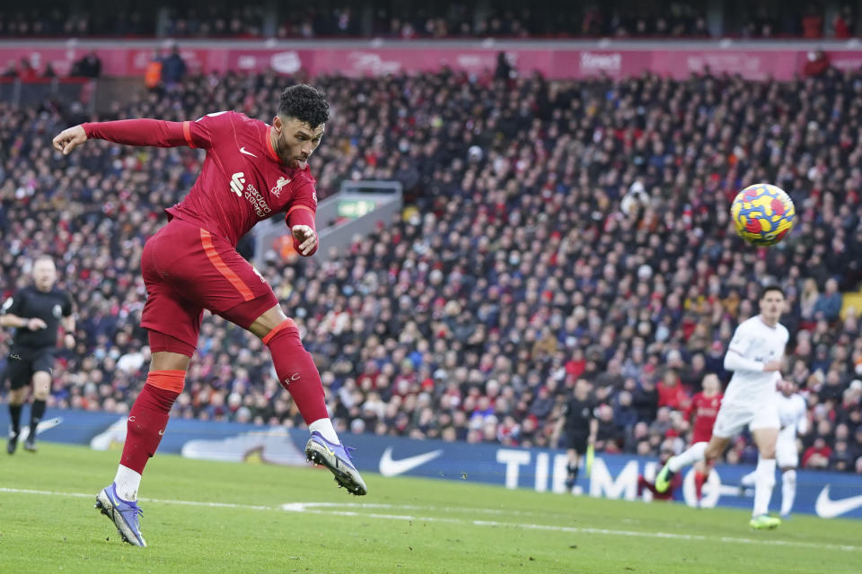 Liverpool's Alex Oxlade-Chamberlain shoots on goal during an English Premier League soccer match between Liverpool and Brentford at Anfield in Liverpool, England, Sunday, Jan. 16, 2022. (AP Photo/Jon Super)