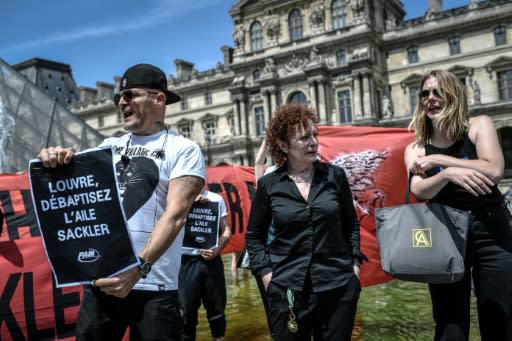 "The crisis is about to hit France," former opioid addict Nancy Goldin, centre, told the protesters in Paris