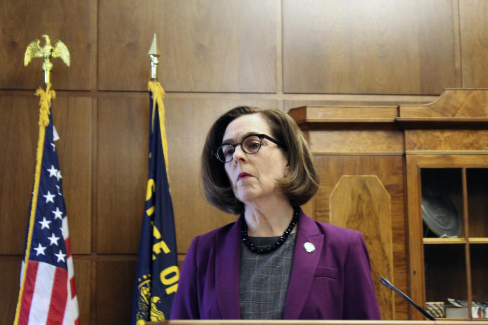 Gov. Kate Brown of Oregon denounces a walkout by Republicans in the state Senate that prevented a quorum on Monday, Feb. 24, 2020 in Salem, Ore. Republican lawmakers are trying to doom a contentious climate change bill. Brown said the Republicans are not against the climate policy but are against the Democratic process. (AP Photo/Andrew Selsky)