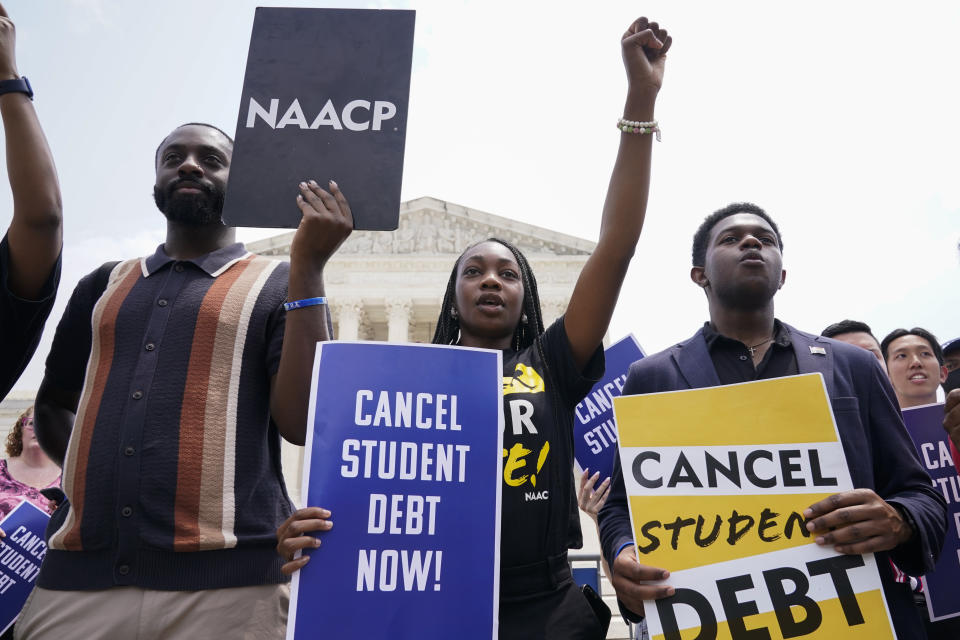 FILE - Students demonstrates about student loan debt outside the Supreme Court, June 30, 2023, in Washington. Biden is traveling to Wisconsin Monday, April 8 2024, to announce details of a new plan to help millions of people with their student loan debt. Last year, the U.S. Supreme Court foiled Biden's plan to provide hundreds of billions of dollars in student loan debt relief to millions. (AP Photo/Jacquelyn Martin, File)