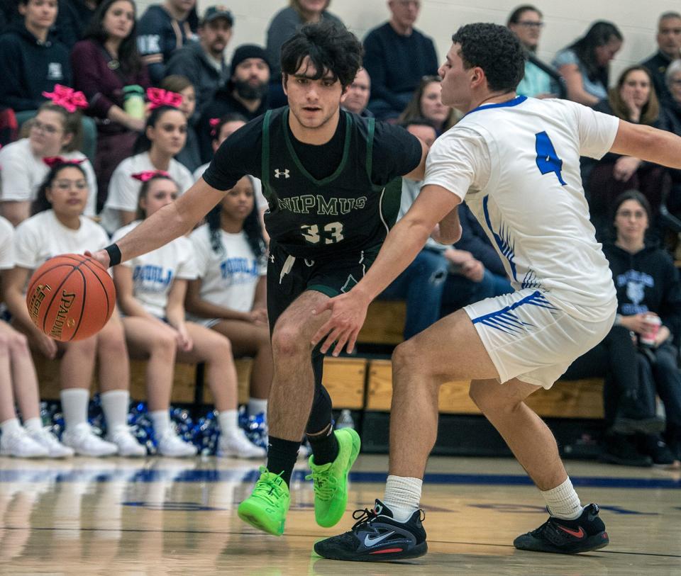 Nipmuc High School's Jake Giardini with the ball against Douglas, Jan. 3, 2024.