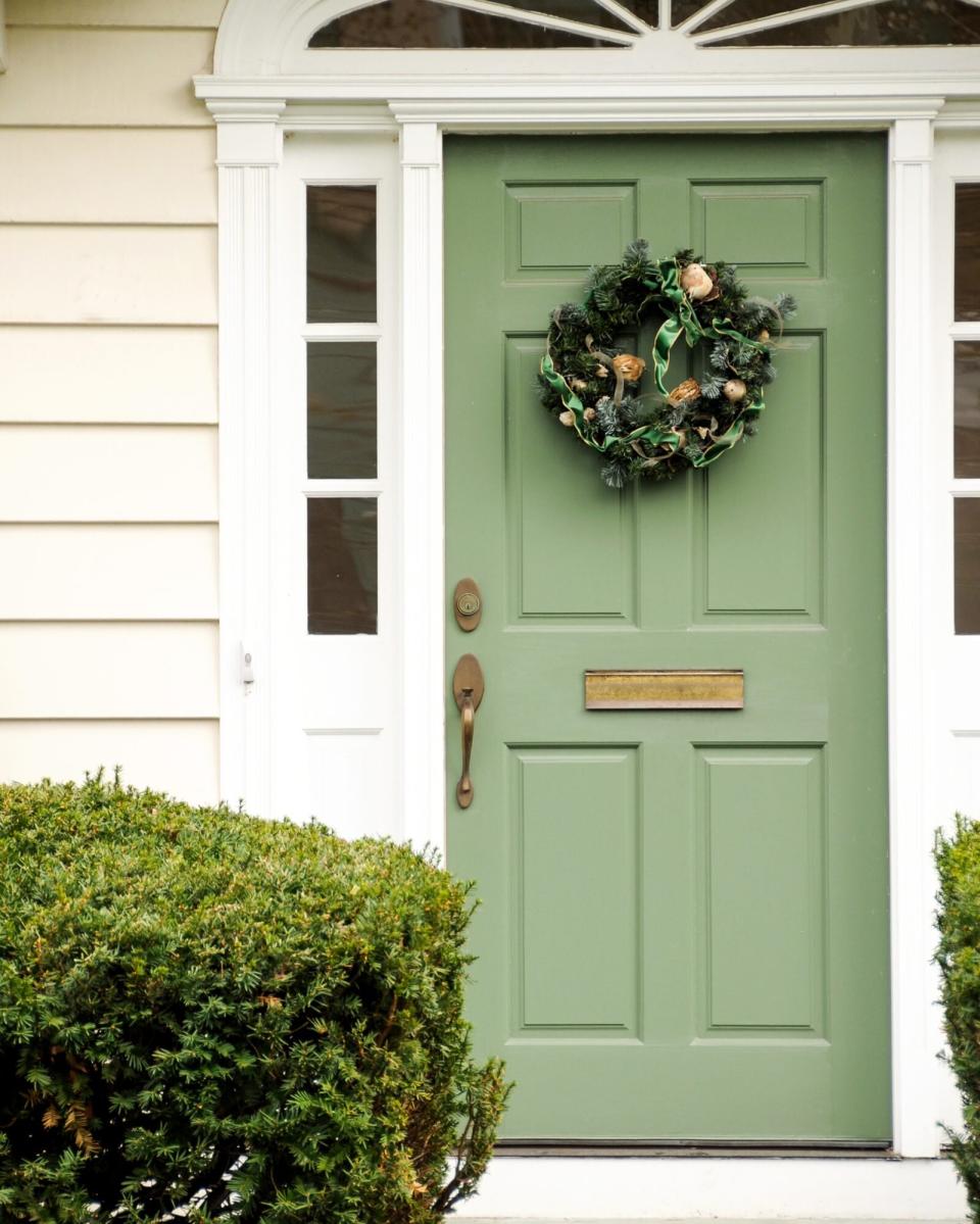 Pale Green door with wreath in Colonial style