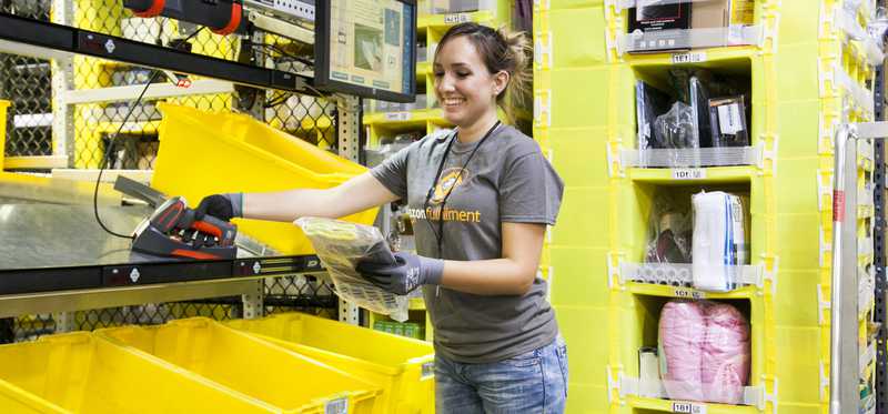 A female worker in an Amazon fulfillment center.