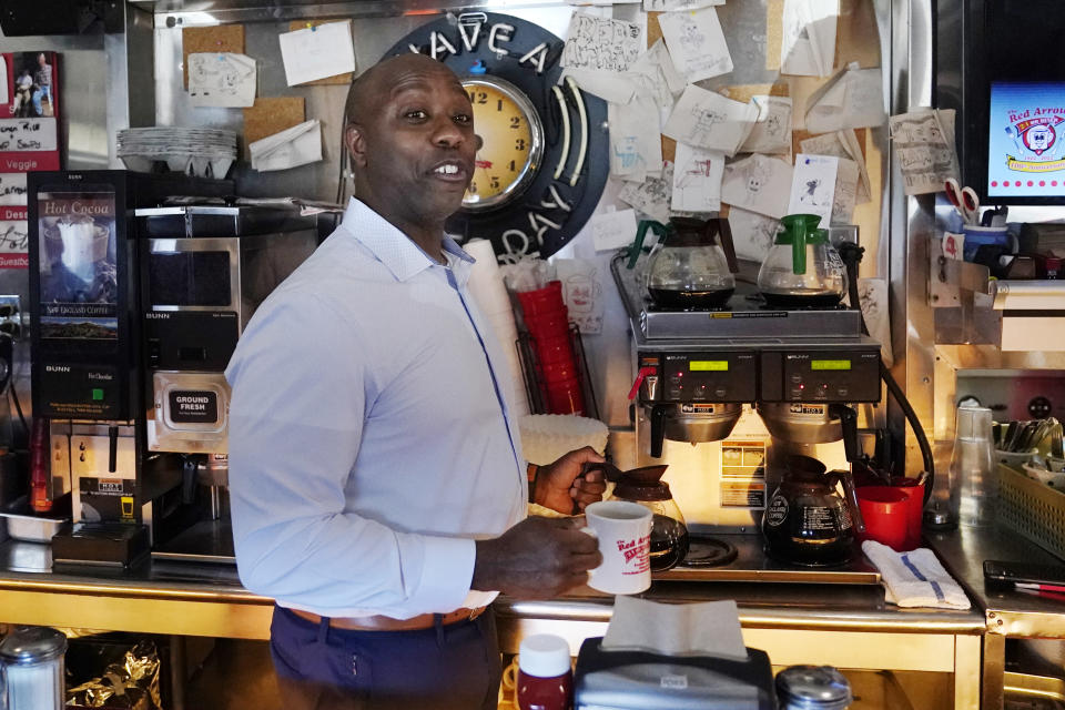 Sen. Tim Scott, R-S.C., pours himself a cup of coffee during a visit to the Red Arrow Diner, Thursday, April 13, 2023, in Manchester, N.H. Scott on Wednesday launched an exploratory committee for a 2024 GOP presidential bid, a step that comes just shy of making his campaign official. (AP Photo/Charles Krupa)