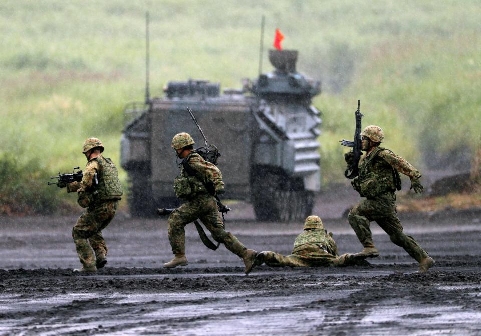 Japanese Ground Self-Defense Force soldiers take part in an annual training session near Mount Fuji at Higashifuji training field in Gotemba