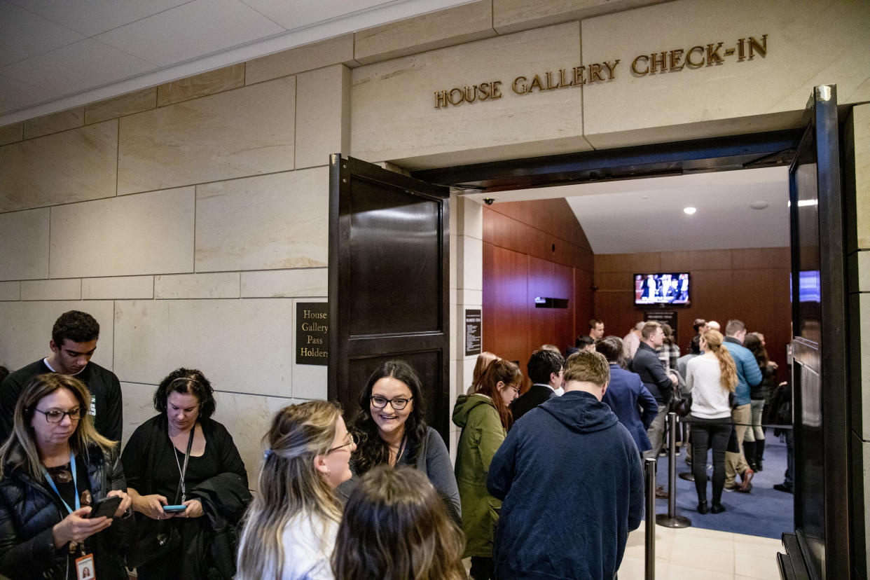 Tourists waited in line on Wednesday for a chance to get into the House chamber to watch lawmakers debate the impeachment of President Donald Trump. (Photo: Samuel Corum via Getty Images)