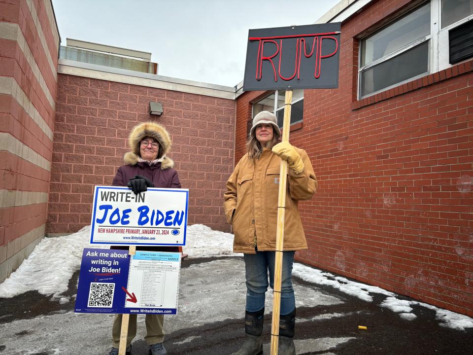 Janet Mason, a Biden supporter, left, and Mary Hebbard, a Trump supporter, are neighbors in Dover. They say their differing views on presidential politics doesn't lead to hostility. They are seen outside the city's Ward 4 polls outside Garrison Elementary School during New Hampshire primary voting Tuesday, Jan. 23, 2024.