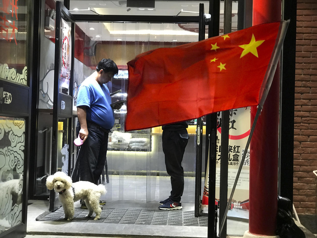 The Chinese city of Wenshan has declared that dogs can only be outside before 7am and after 10pm (Picture: AP)
