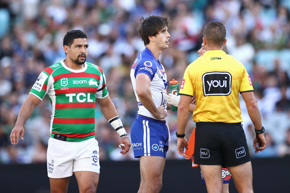 Lachlan Lewis (pictured right) of the Bulldogs receives attention during the round four NRL match between the Canterbury Bulldogs and the South Sydney Rabbitohs at Stadium Australia, on April 02, 2021, in Sydney, Australia. 